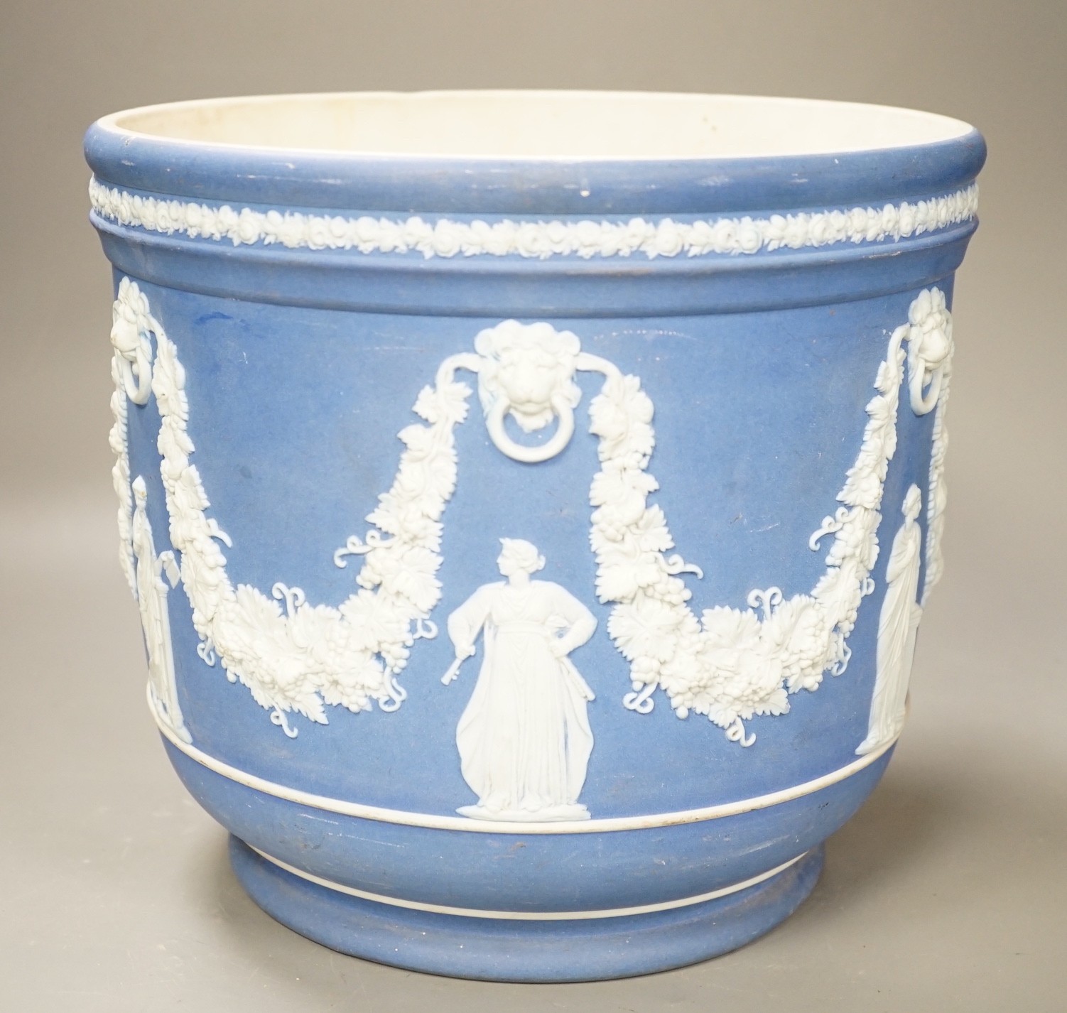 A Wedgwood blue jasper jardiniere, sprigged with muses and swags, height 23cm